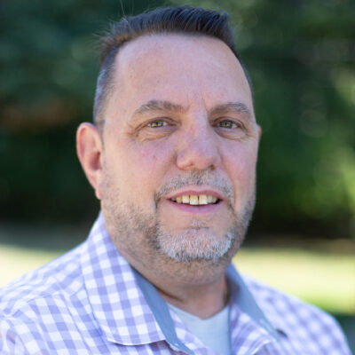 A man in a gingham shirt